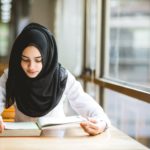 Muslim-girl-student-studying-at-the-library