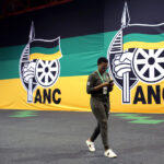 An ANC member arrives at the 54th National Conference of the ruling African National Congress (ANC) at the Nasrec Expo Centre in Johannesburg