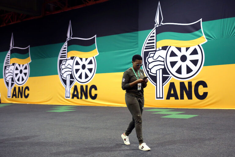 An ANC member arrives at the 54th National Conference of the ruling African National Congress (ANC) at the Nasrec Expo Centre in Johannesburg